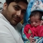 with Papa at the age of 7 days